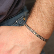 Adjustable Morse code bracelet on Men's hand