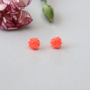 neon luminous orange stud earrings